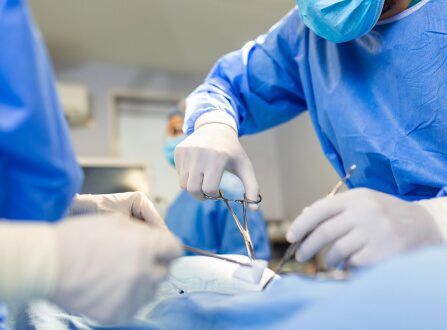 Surgical team operating in an operating room, reflecting the serious medical care behind catastrophic injury cases handled by Aulsbrook Car & Truck Wreck Injury Lawyers Fort Worth